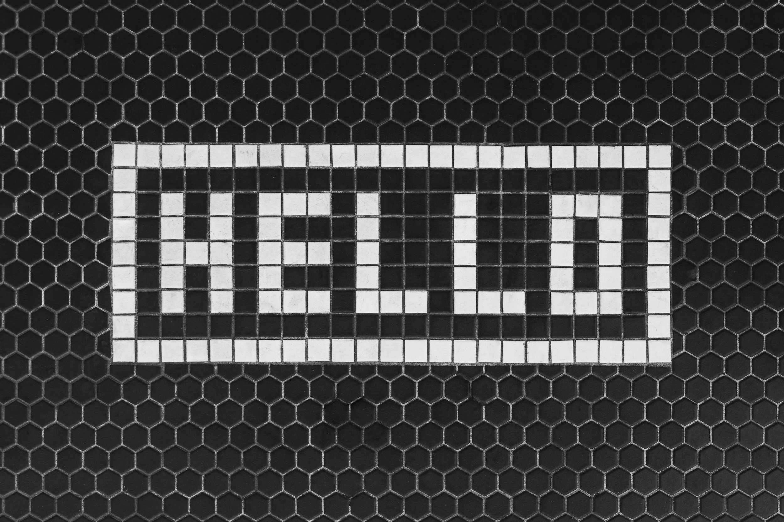 The word hello spelt out in black and white tiles