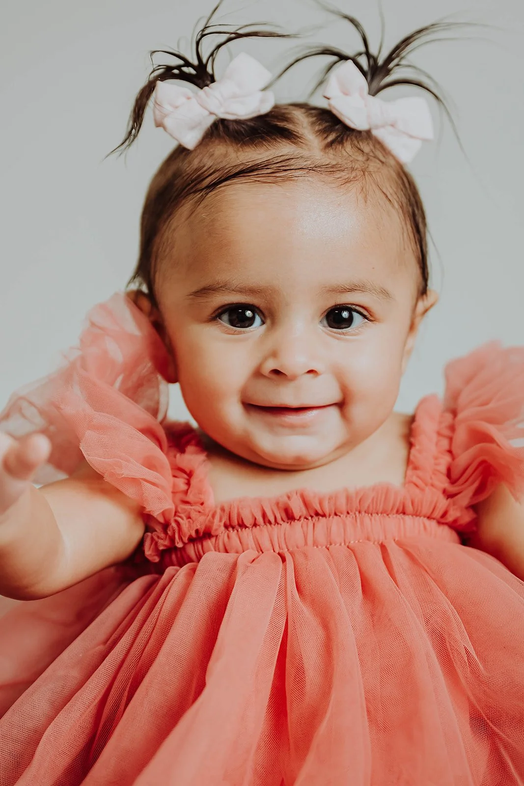   Baby milestone photography series showing newborn, sitter, and first birthday sessions with West Michigan photographer Lexie Marie Photography.  