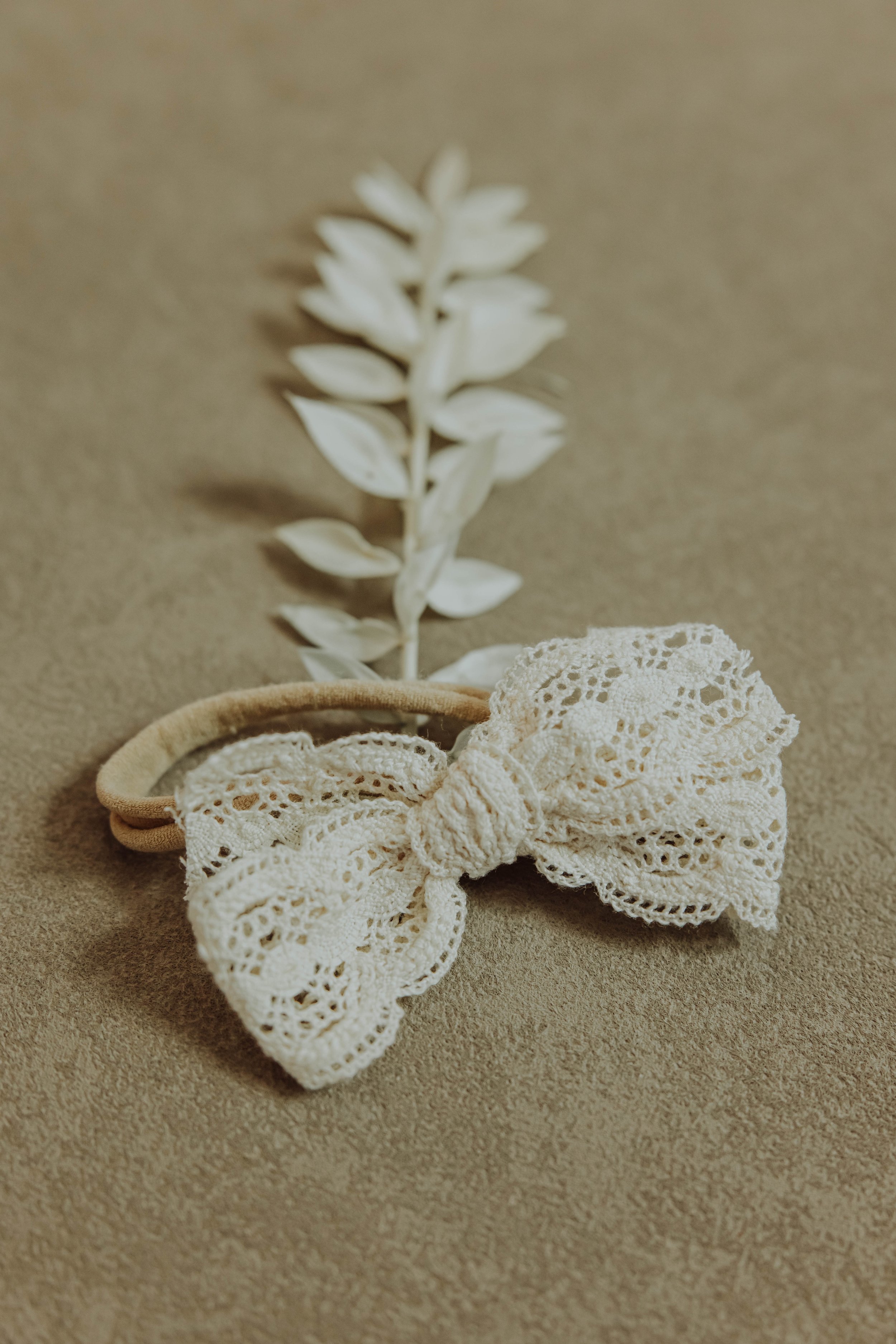   Styled product flat lay for children's clothing brand featuring neutral tones and intentional props.  