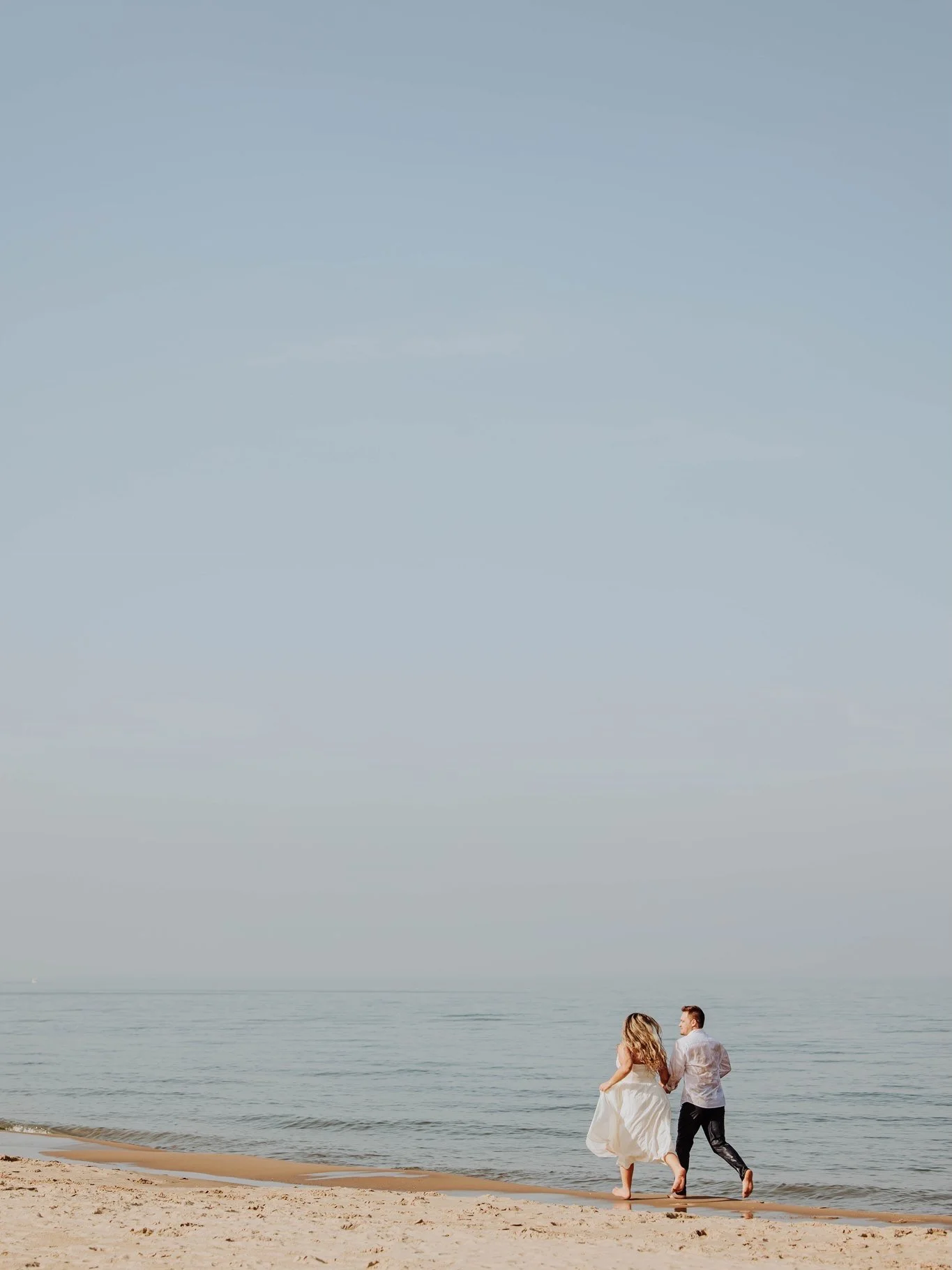 From downtown Holland to the shores of Lake Michigan&hellip; this engagement session was a dream. 🤍✨

We started the morning exploring downtown Holland, soaking up the quiet streets and beautiful light before heading to the beach for sunrise. And le