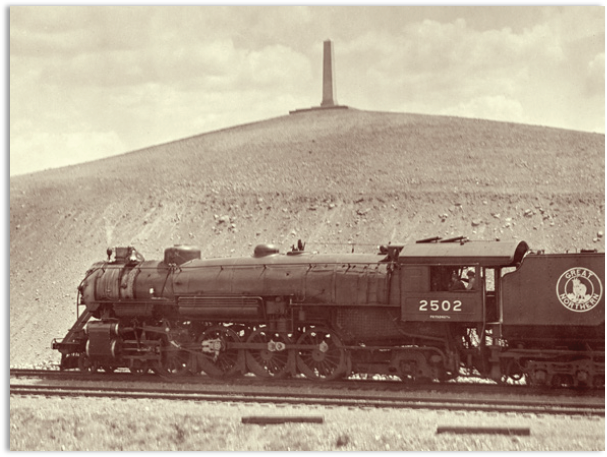 Photo of the Lewis Obelisk and a train in 1926