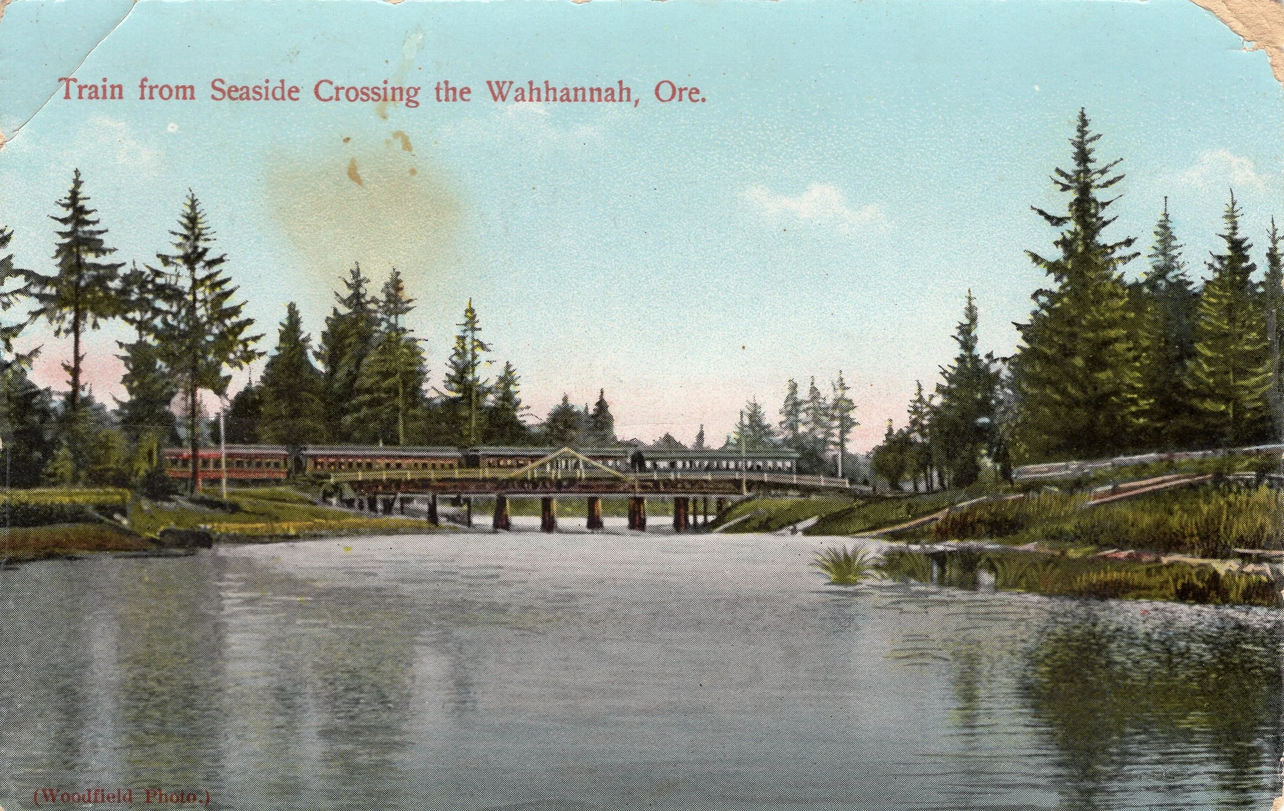Colored postcard of train crossing the Wahanna River in Seaside