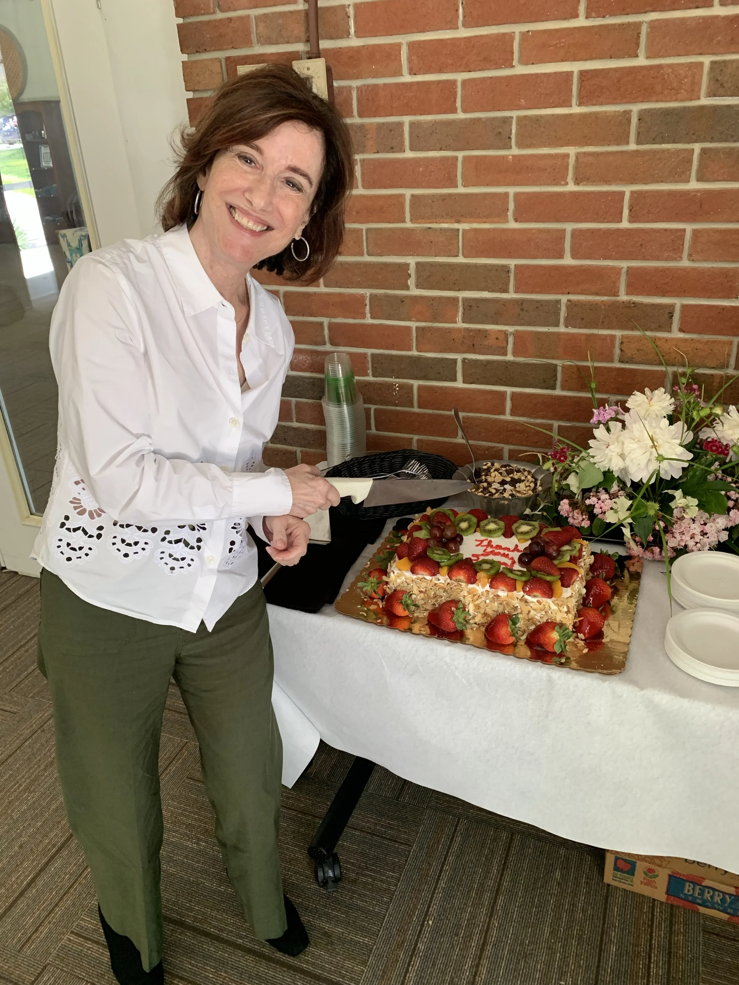 Susan Packard Centering Prayer Scholarship Fund, Susan cutting a cake