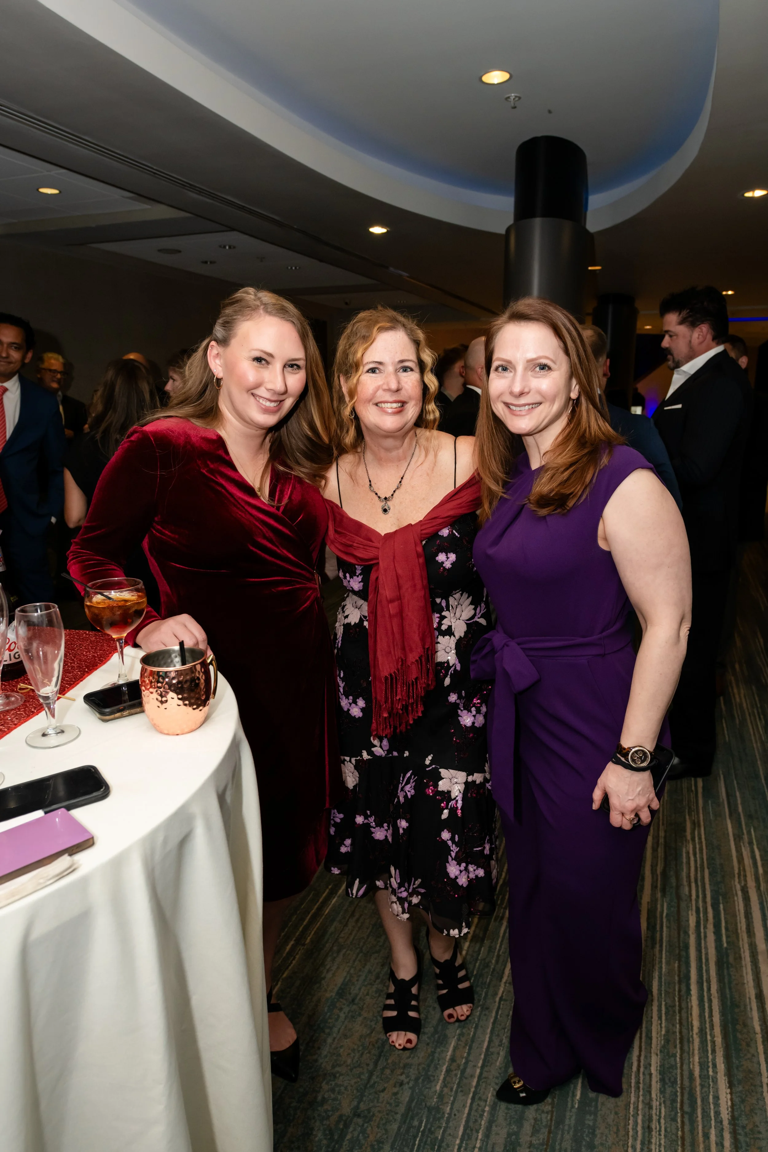 Group of colleagues photographed during a corporate gala cocktail reception