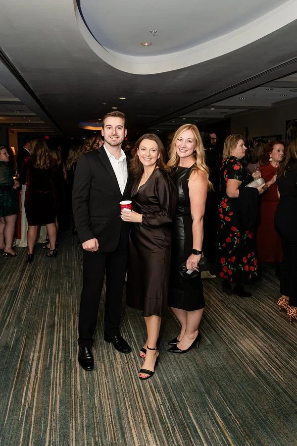 reception-photography.jpg Guests posing together during a corporate gala reception