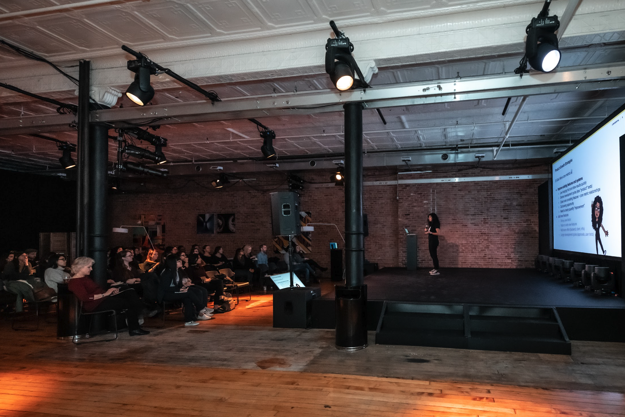 Speaker presenting to an audience at a Dolby and Women Who Code technology event in New York City