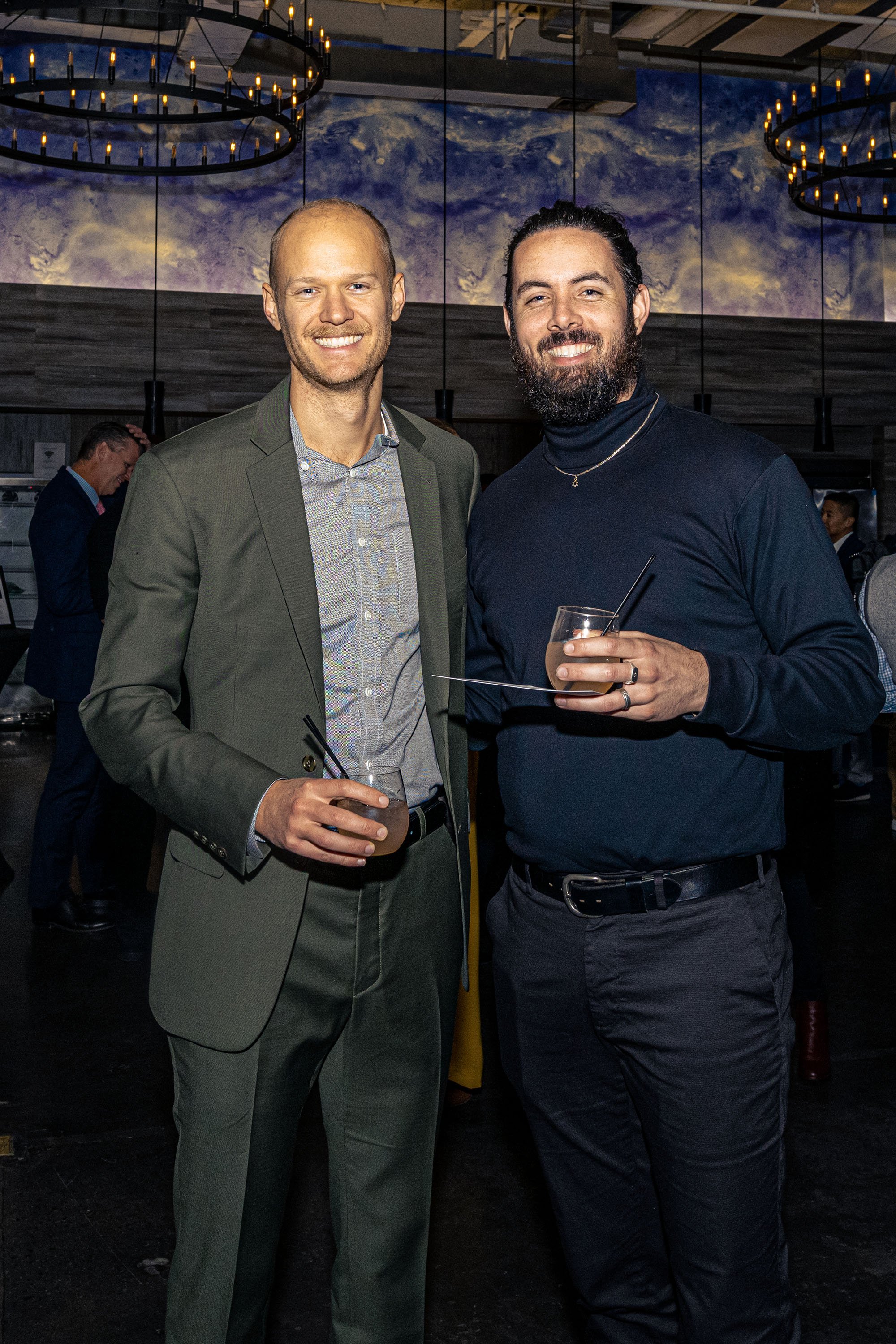Two guests posing for a portrait during a nonprofit fundraising event in NYC