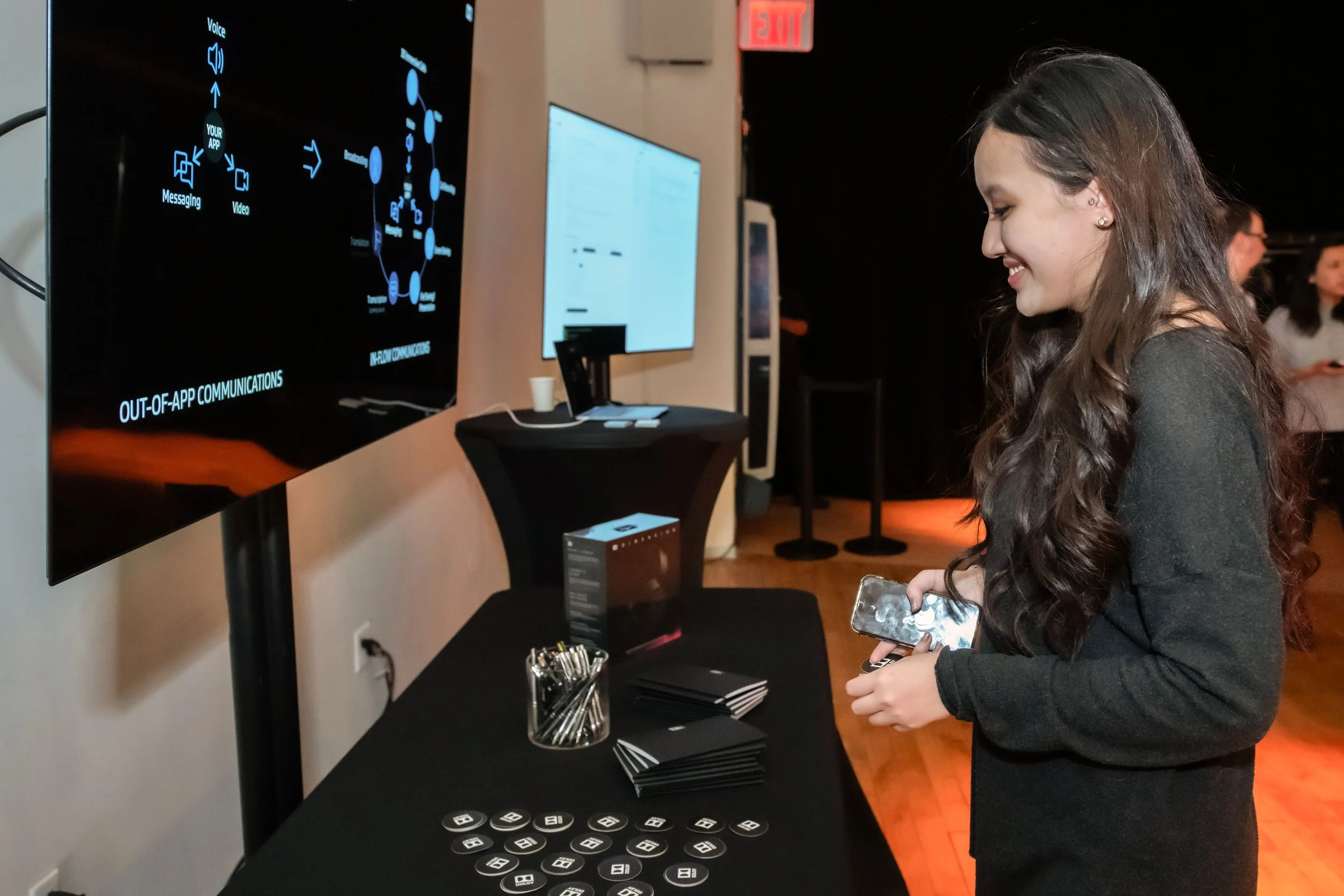 Guest interacting with a technology display at a Dolby corporate event in New York City