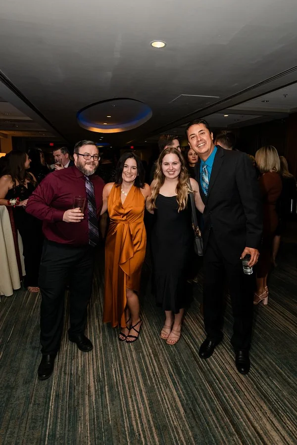 Guests posing together during a corporate gala reception