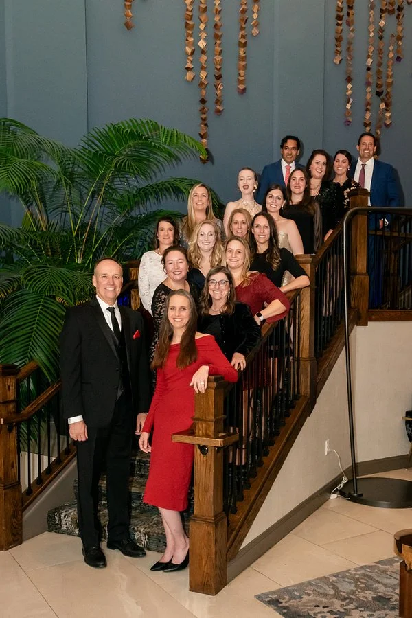 Large team group portrait photographed during a corporate gala