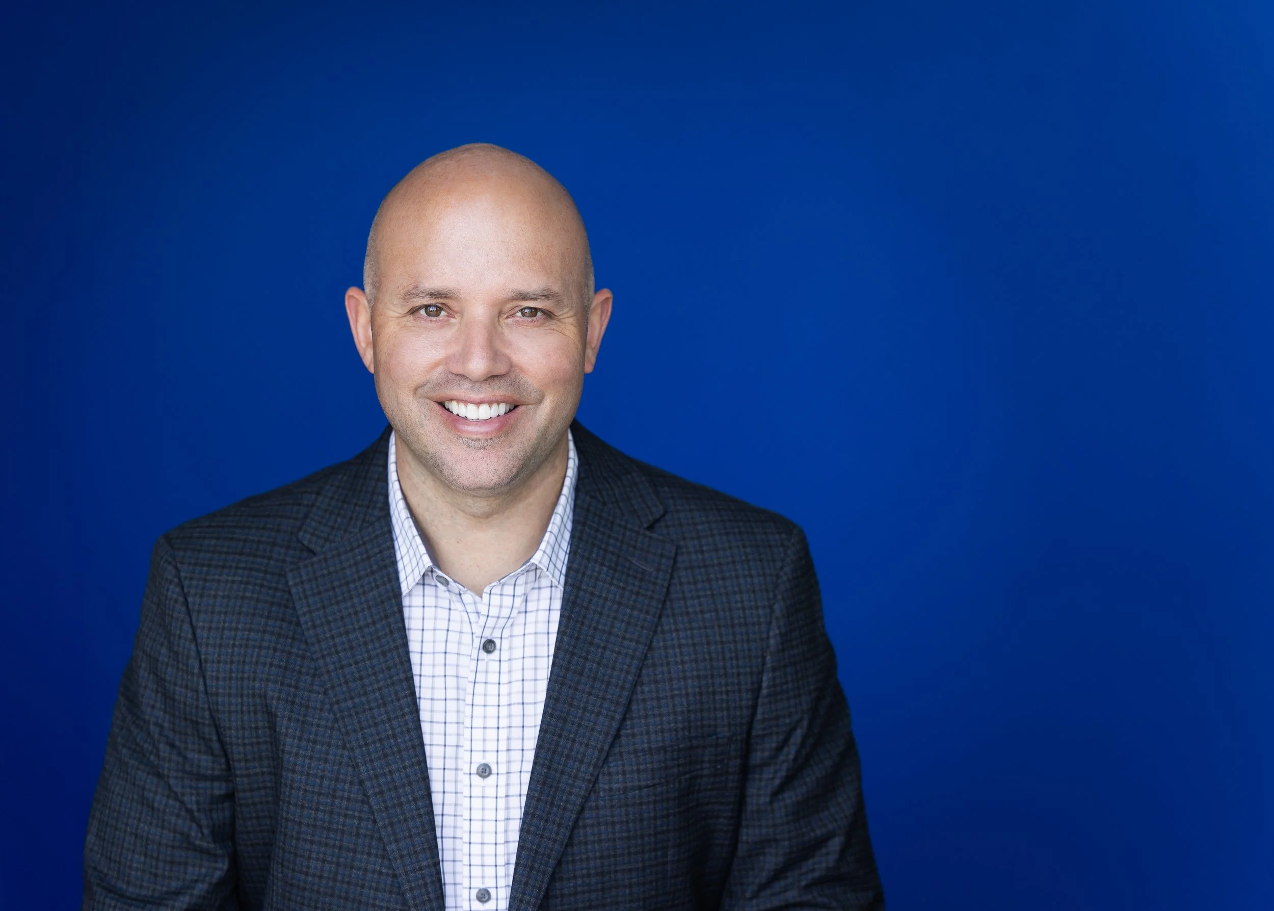 orange-county-headshot-blue-background.jpg