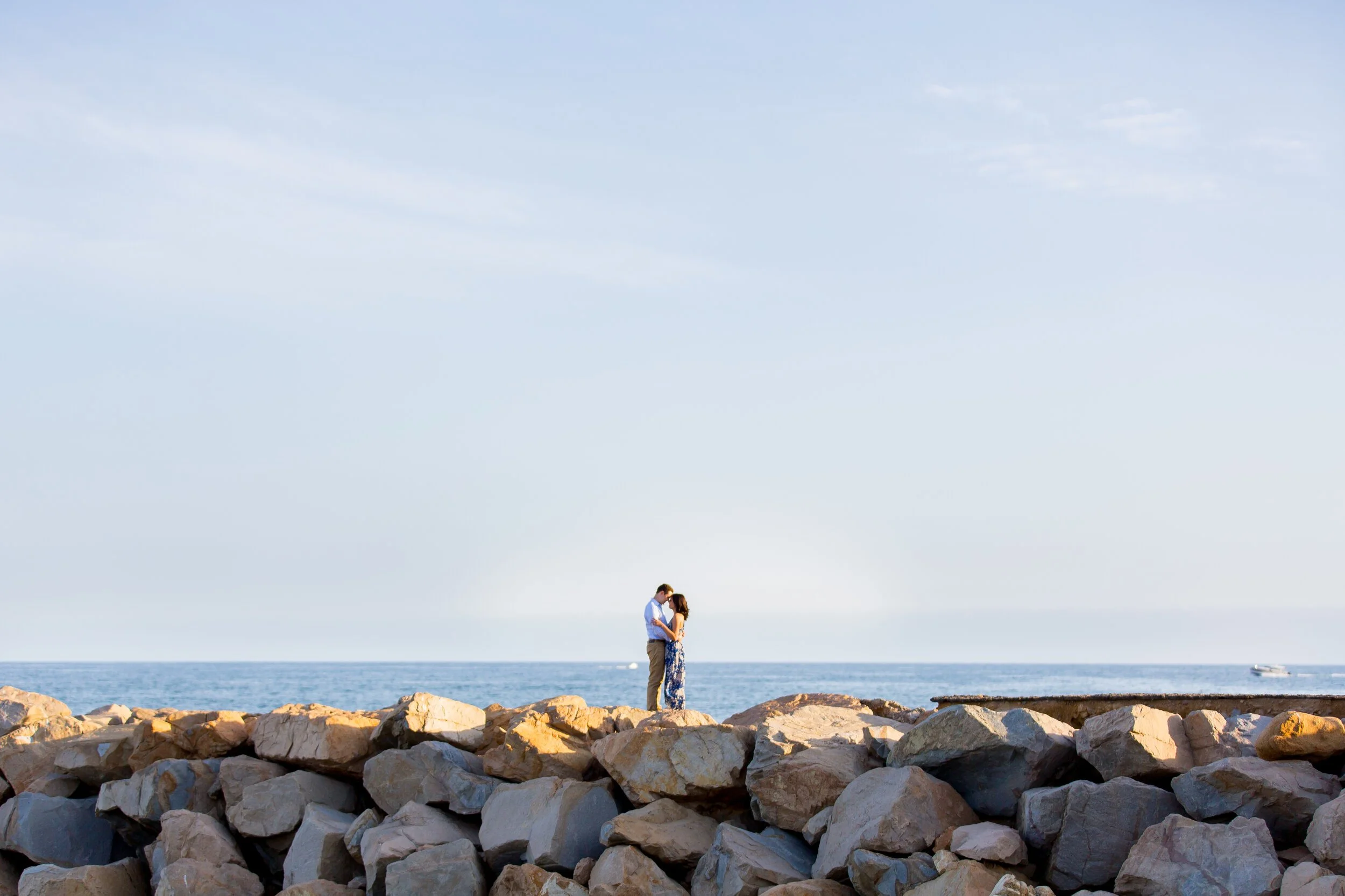 Dana-Point-engagement-photographer-rock-beach.jpeg
