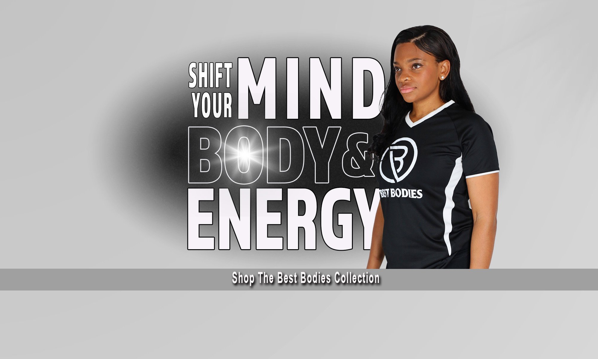 Side profile of woman wearing best bodies teeshirt with text behind her saying "Shift Your Mind, Body, & Energy"
