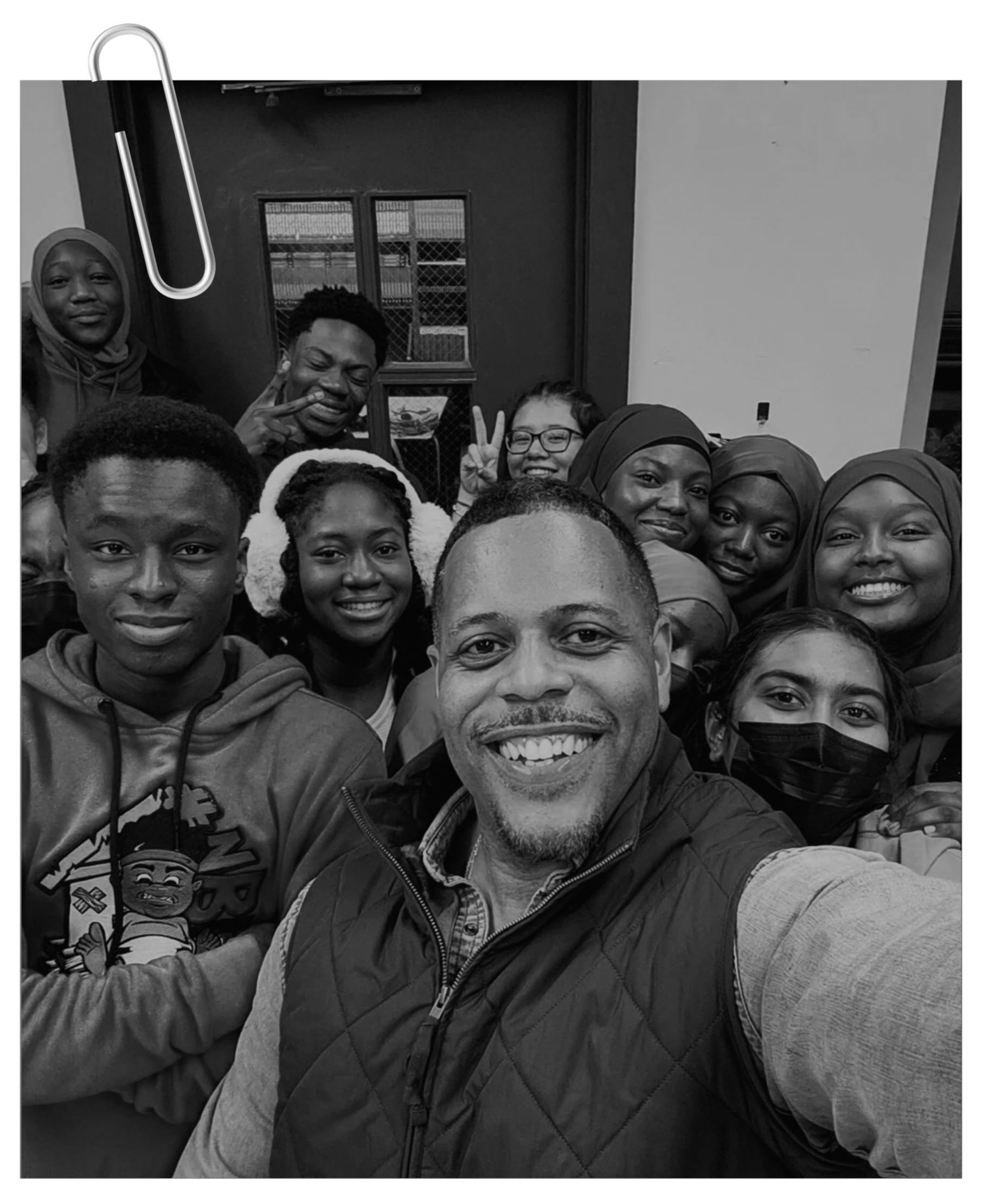 Black and white selfie photo of Joy Roots founder and students smiling