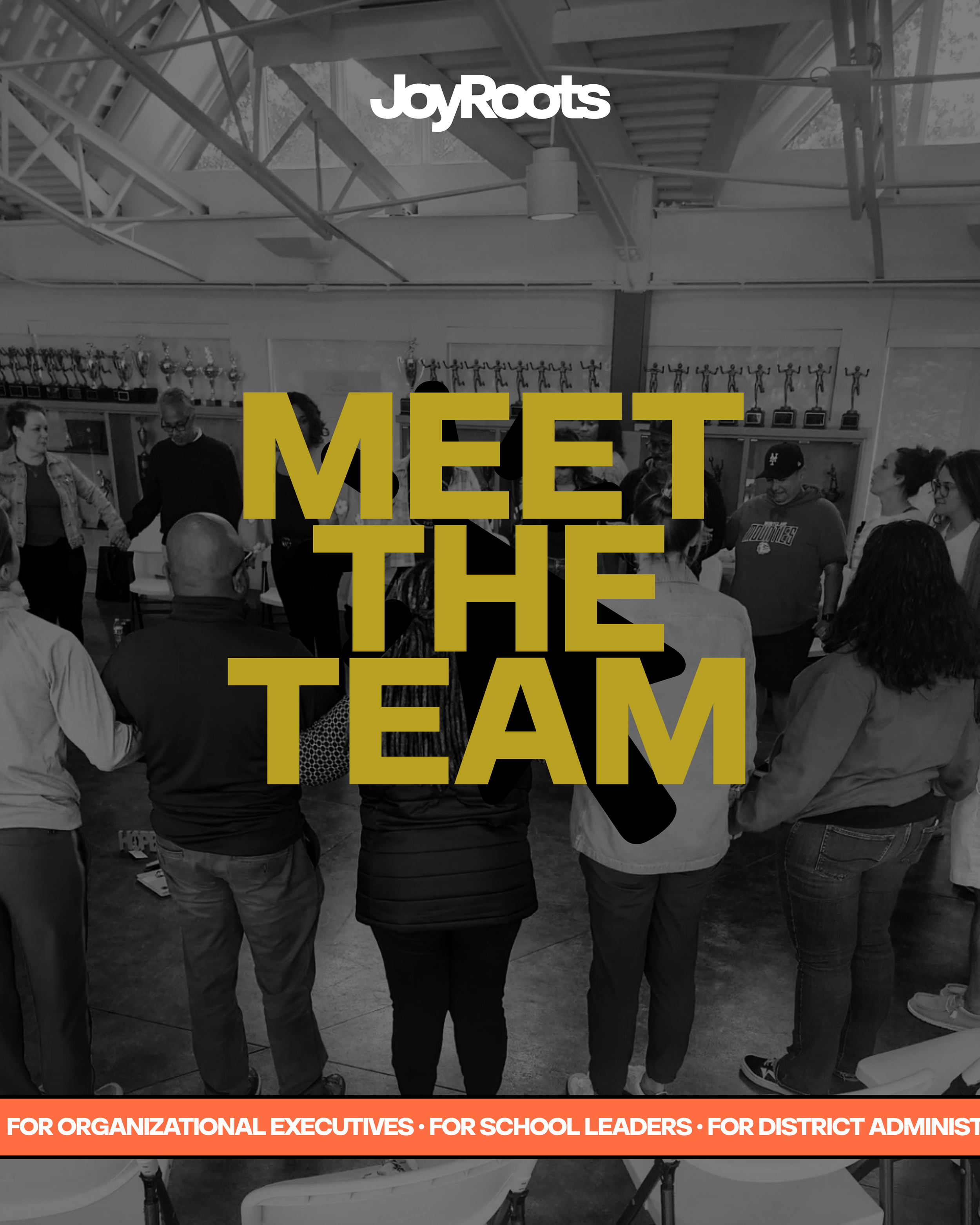 black and white photo of adult educators holding hands in a circle during a professional development session