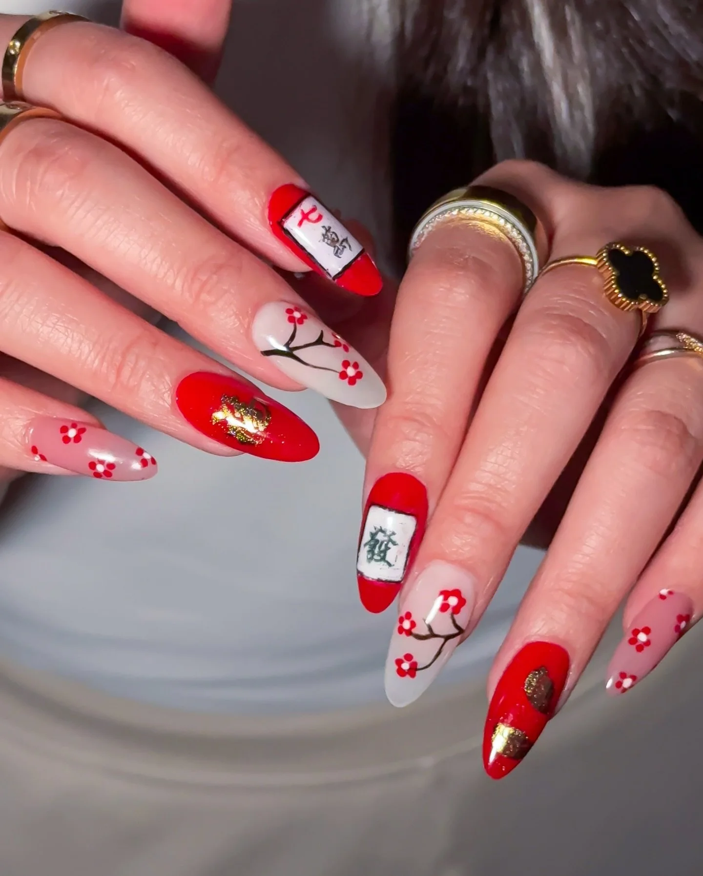 Lunar New Year, but make it playful. 🧧✨

A bold red and milky white palette,
accented with delicate handcrafted details and mahjong-inspired elements.

Cute with intention,
lucky with a touch of fun.

Because festive nails can still feel refined and