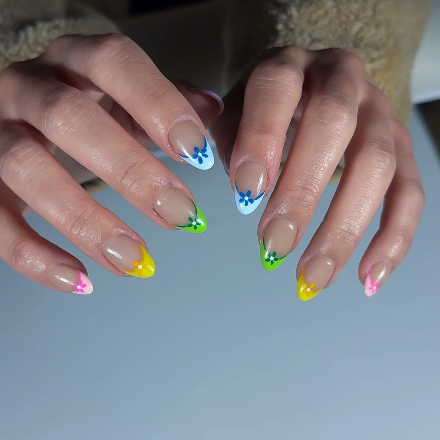 Colorful French with tiny florals ✿

A playful twist on a classic &mdash;
soft nude base with pops of color and delicate flowers.

Finished with hard gel + Russian manicure
for a thin, balanced structure and clean cuticles ✨

🎀 Fun but still wearabl