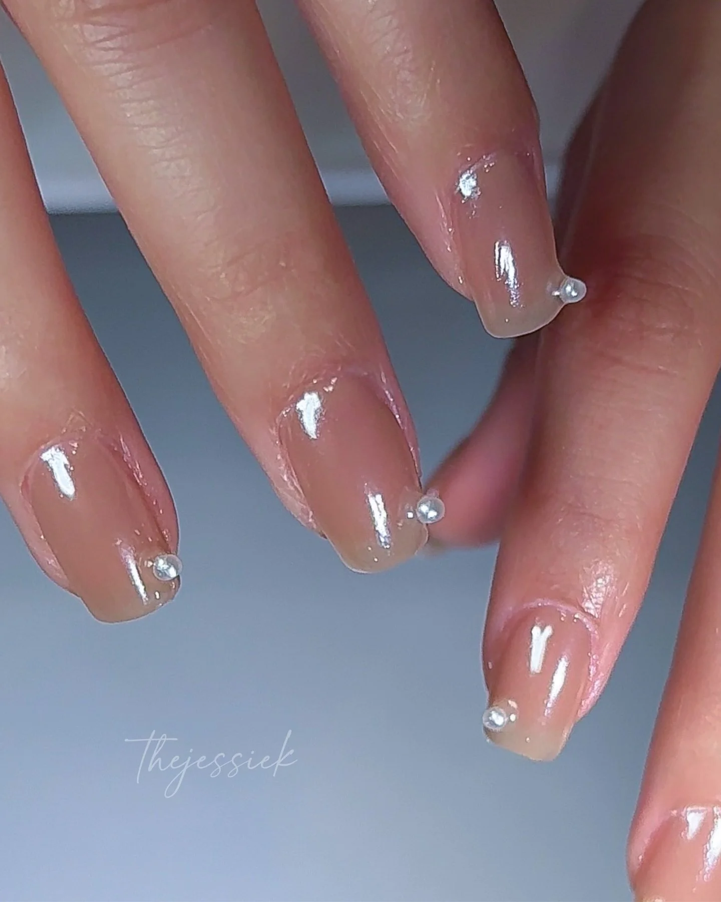 ✨ Bridal Pearl Nails ✨

Soft, elegant, and timeless ♡

This bridal set features a structured hard gel overlay with a sheer nude base, chrome powder finish, and delicate pearl accents for a clean, sophisticated look that complements any wedding dress 