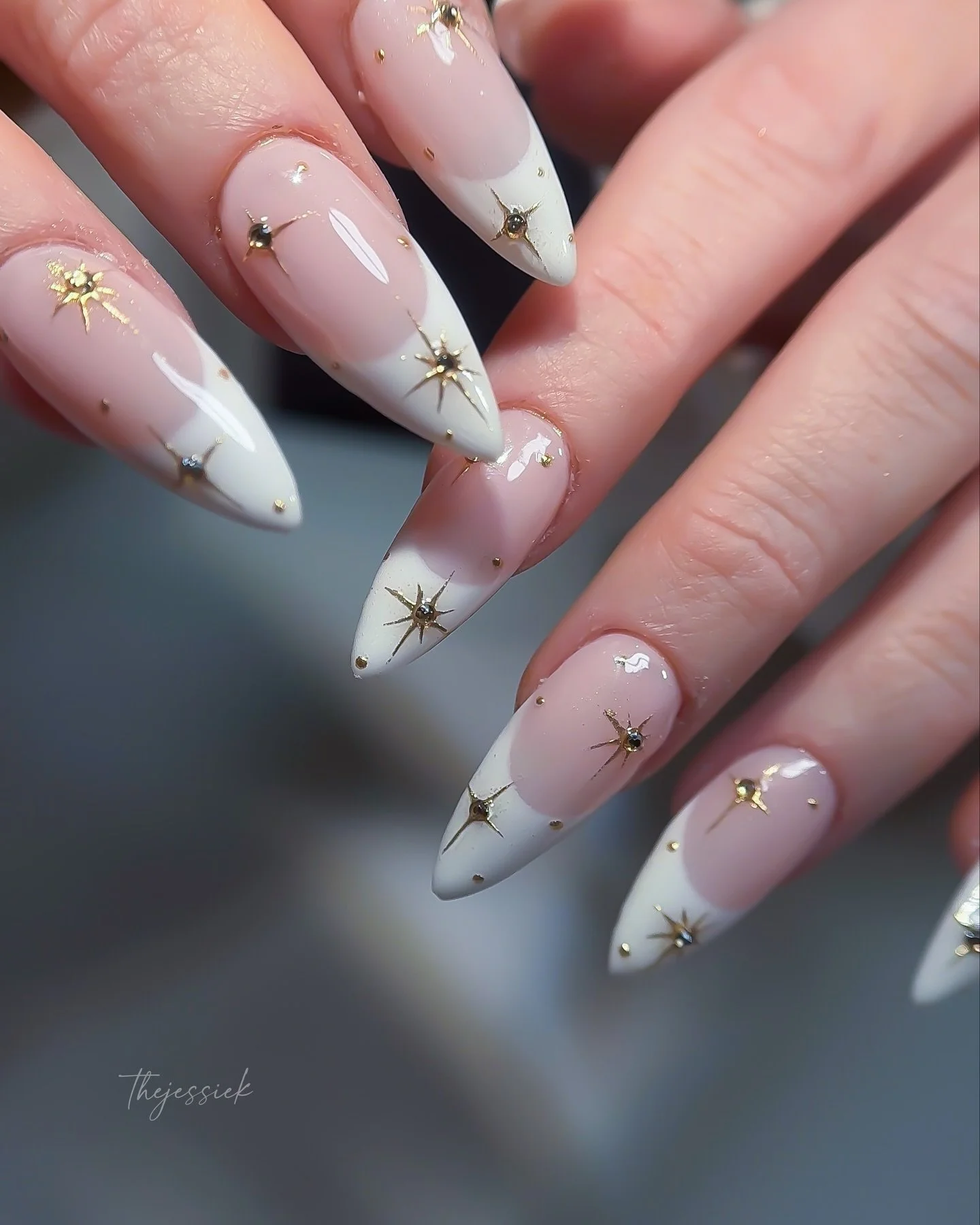 Celestial French nails ✨🤍

Classic white French with delicate gold starburst details &mdash; clean, elegant, with a little extra sparkle.

Gel-X extensions + Russian manicure for a clean, polished finish. ✨

📍Private nail studio in Arcadia, CA
By a