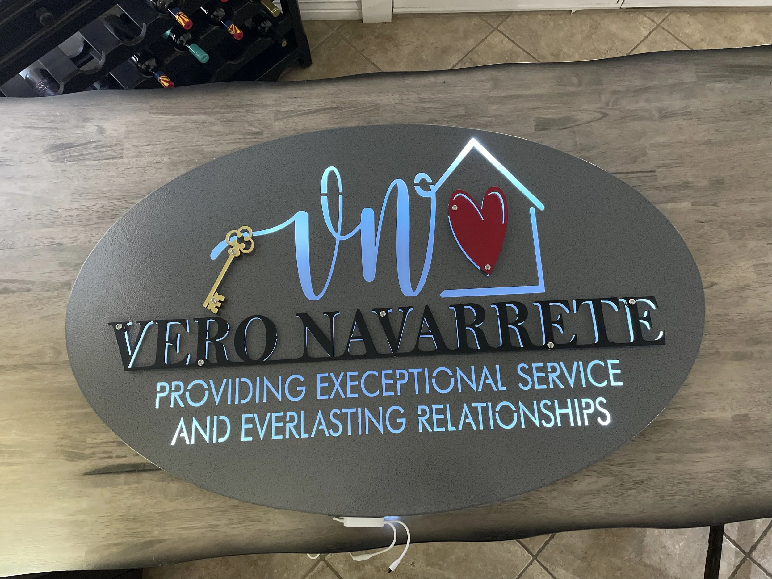 4-Layer Powder Coated steel sign with white acrylic backing and LED backlights