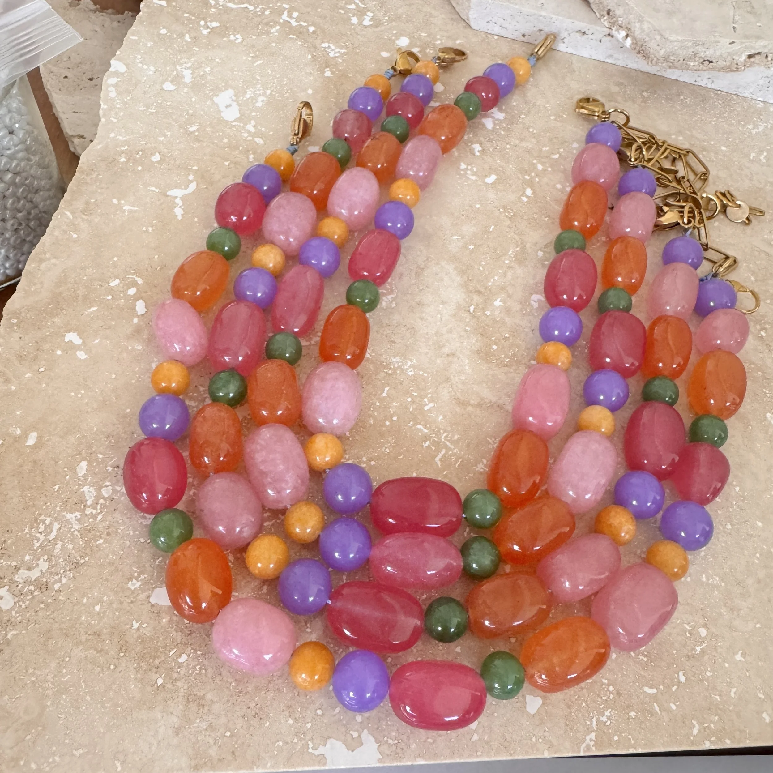 Colorful stone beaded jewellery, including necklaces and earrings, Wilma A red, purple, pinkgreen, orange, and gold beaded necklace, slow-fashion, handmade in Australia, wholesale available.