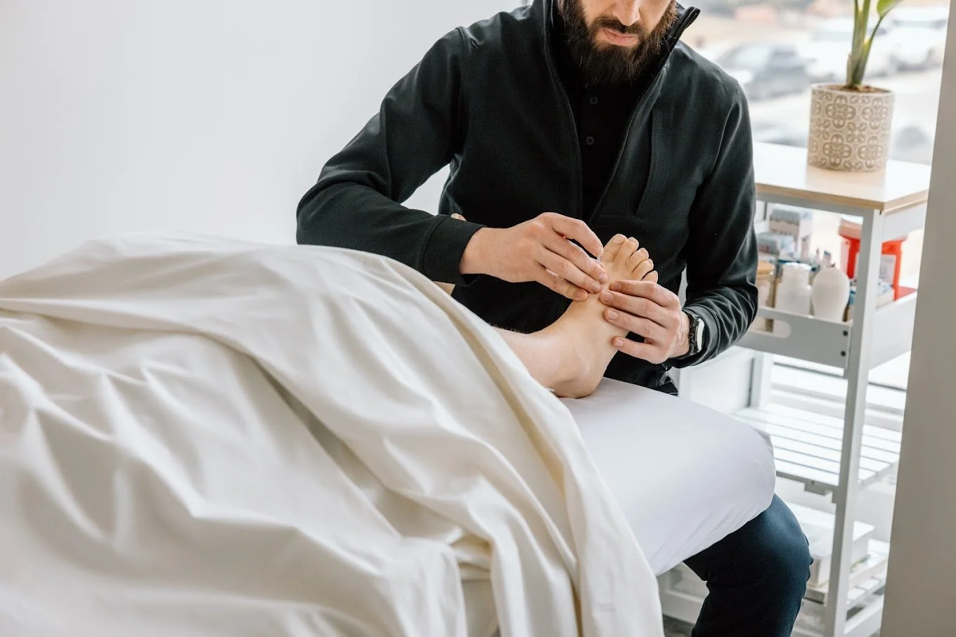 Dr. Joseph Coccagna performing acupuncture for IBS in NW Calgary