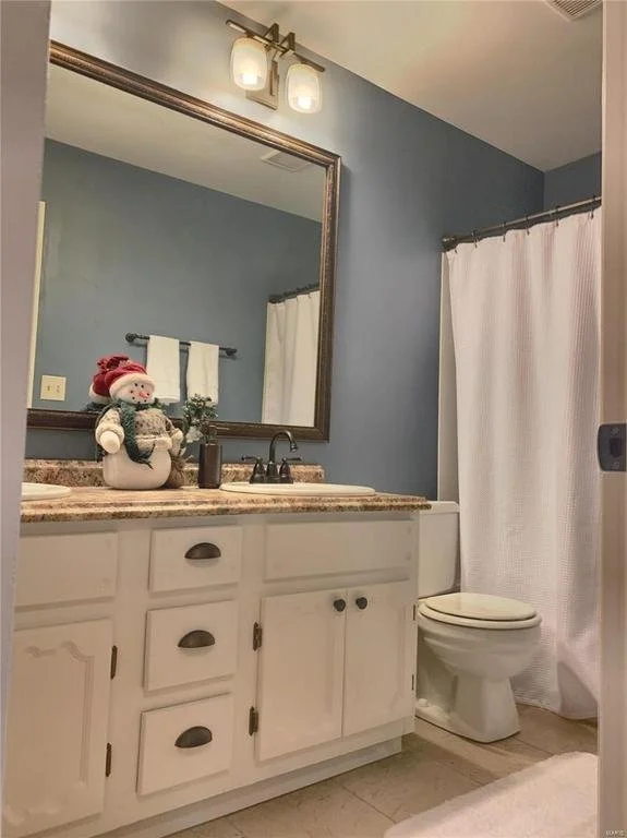Upstairs after.  A project I had started with my Grandpa about 10 years ago, hard to remember, but I love the contrast of wall color he chose verse my Grandma.  It is a very calming blue, we used the same floor tile, kept the vanity and painted it, a