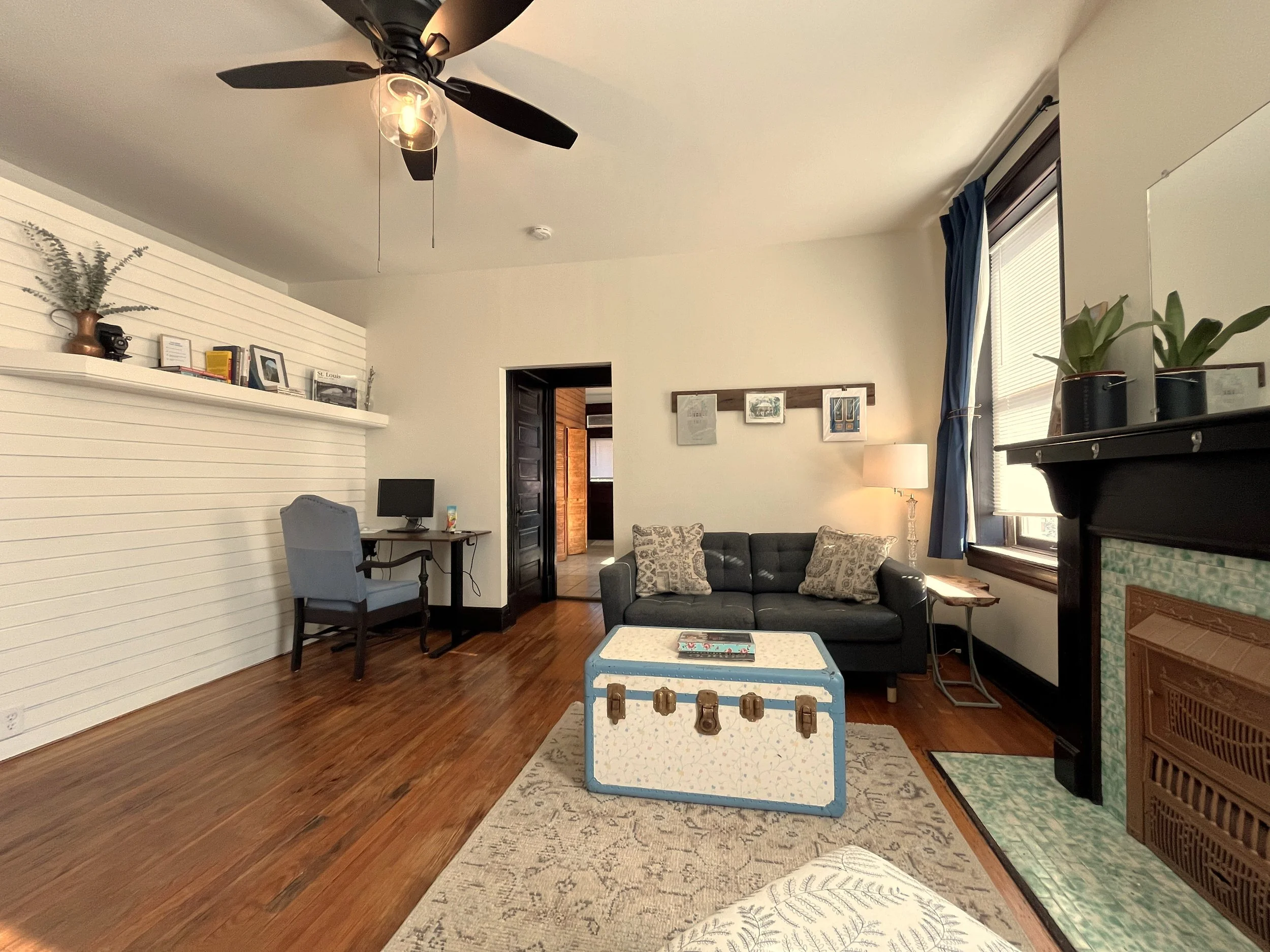 In the living room, we refinished the floors, installed a new ceiling fan. 