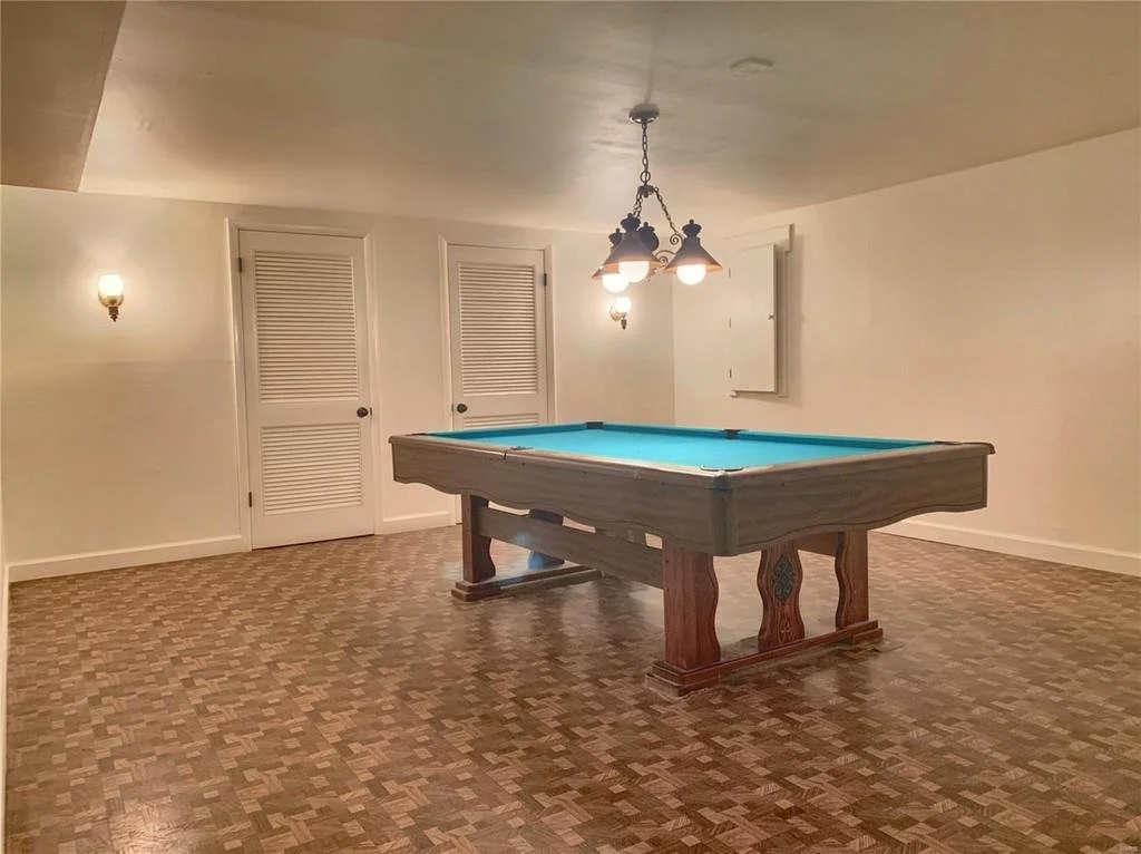 With a good cleaning, fresh paint, refurbished light fixtures, and pool table, this space came back to life.
