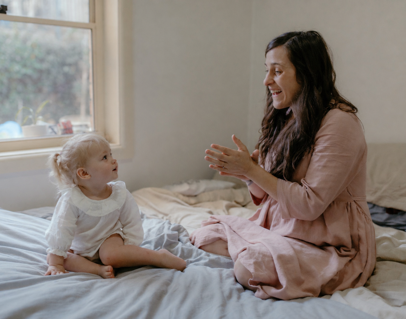 ESDM therapist engaging in play-based interaction with a young child to support communication, social connection, and early childhood development