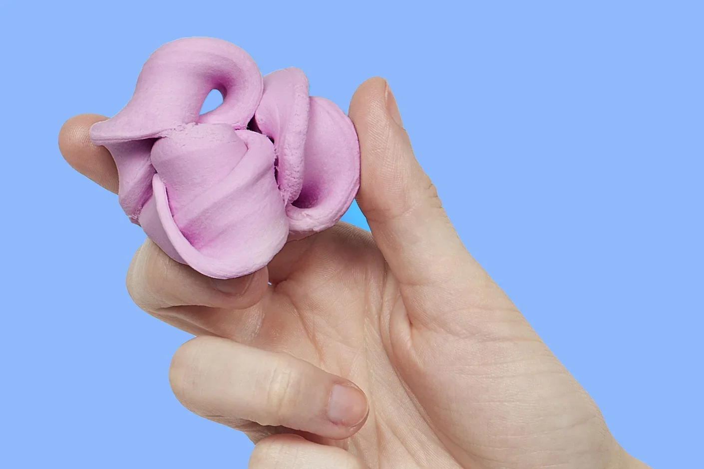 speks-blur-fidget-toy-blush-hand.webp