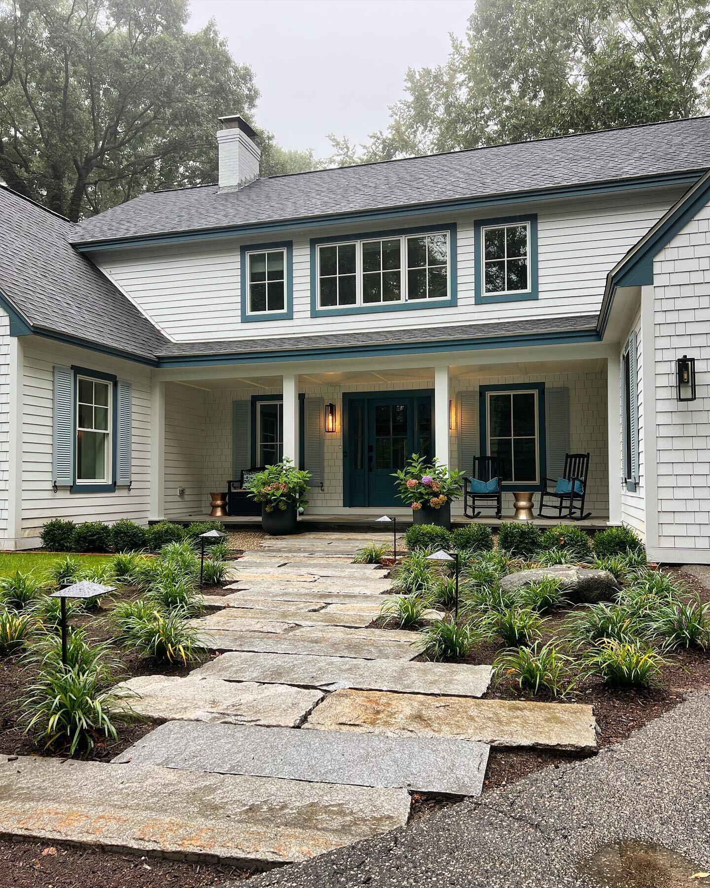 Antiqued granite walkway adding a little history to this private beach house.