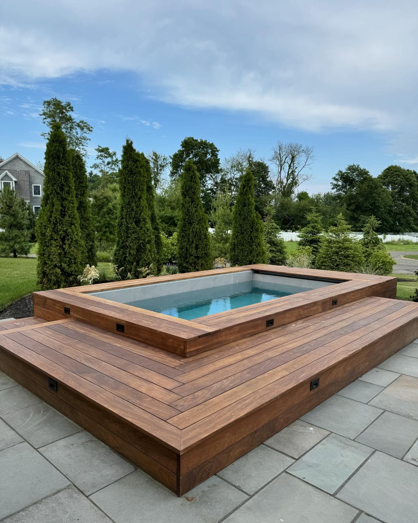 Ipe wrapped plunge pool from @soakepools nestled right into this existing landscape.