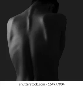 beautiful-woman-back-on-dark-260nw-164977904.webp