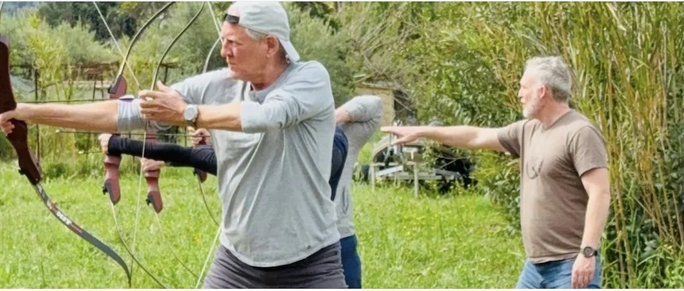 Micah teaching archery in Greece