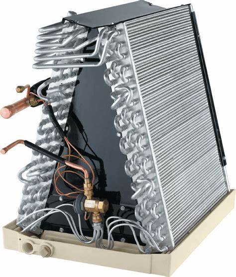 A refrigerator compressor with cooling coils and copper tubes.