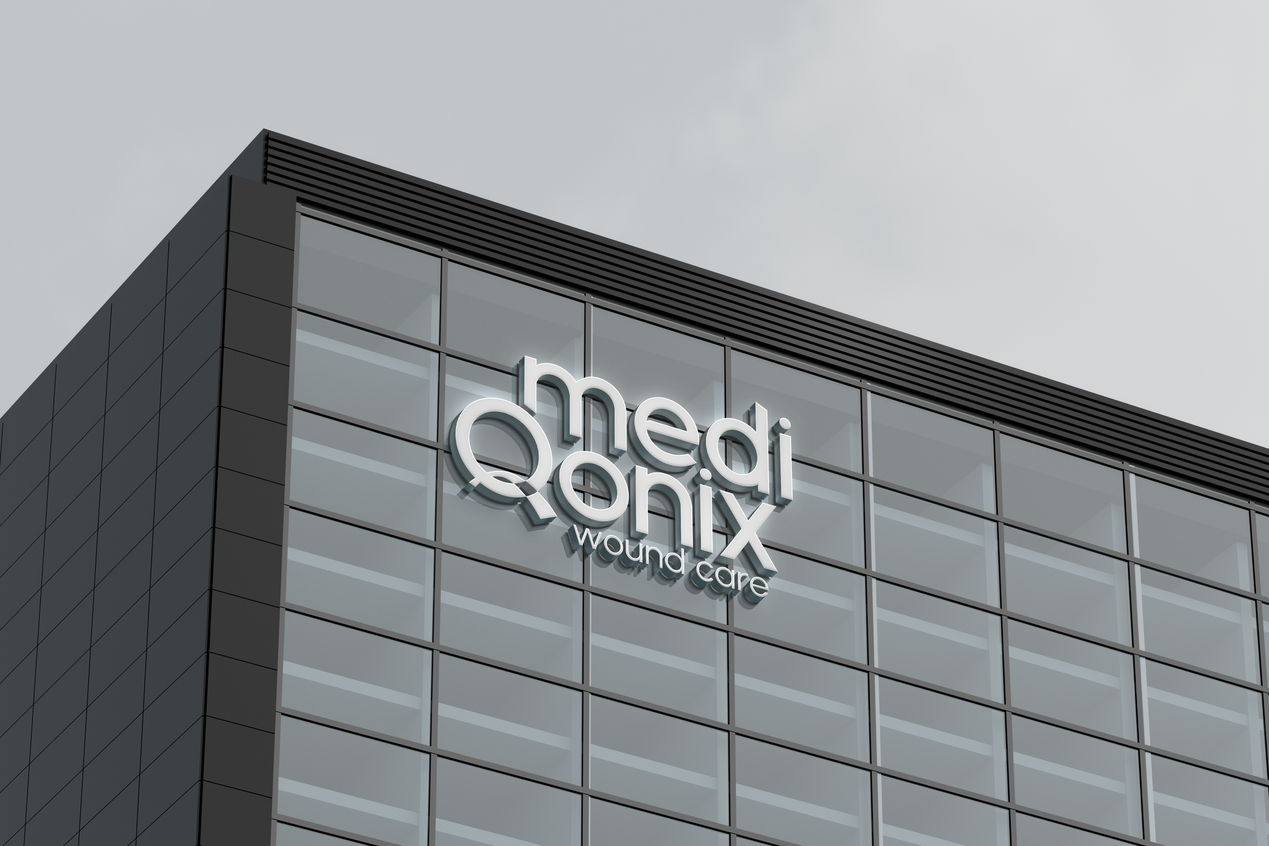 Close-up view of a modern medical building with large glass windows and black cladding, displaying the sign 'Medix' in illuminated letters, under an overcast sky.