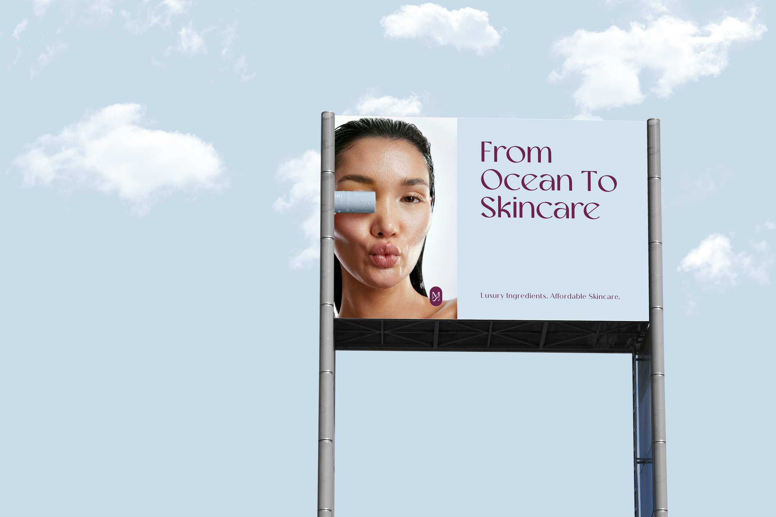 Billboard with a woman making a duck face, partially obscured by a smaller display block, and the text 'From Ocean To Skincare' with the tagline 'Luxury Ingredients. Affordable Skincare'.