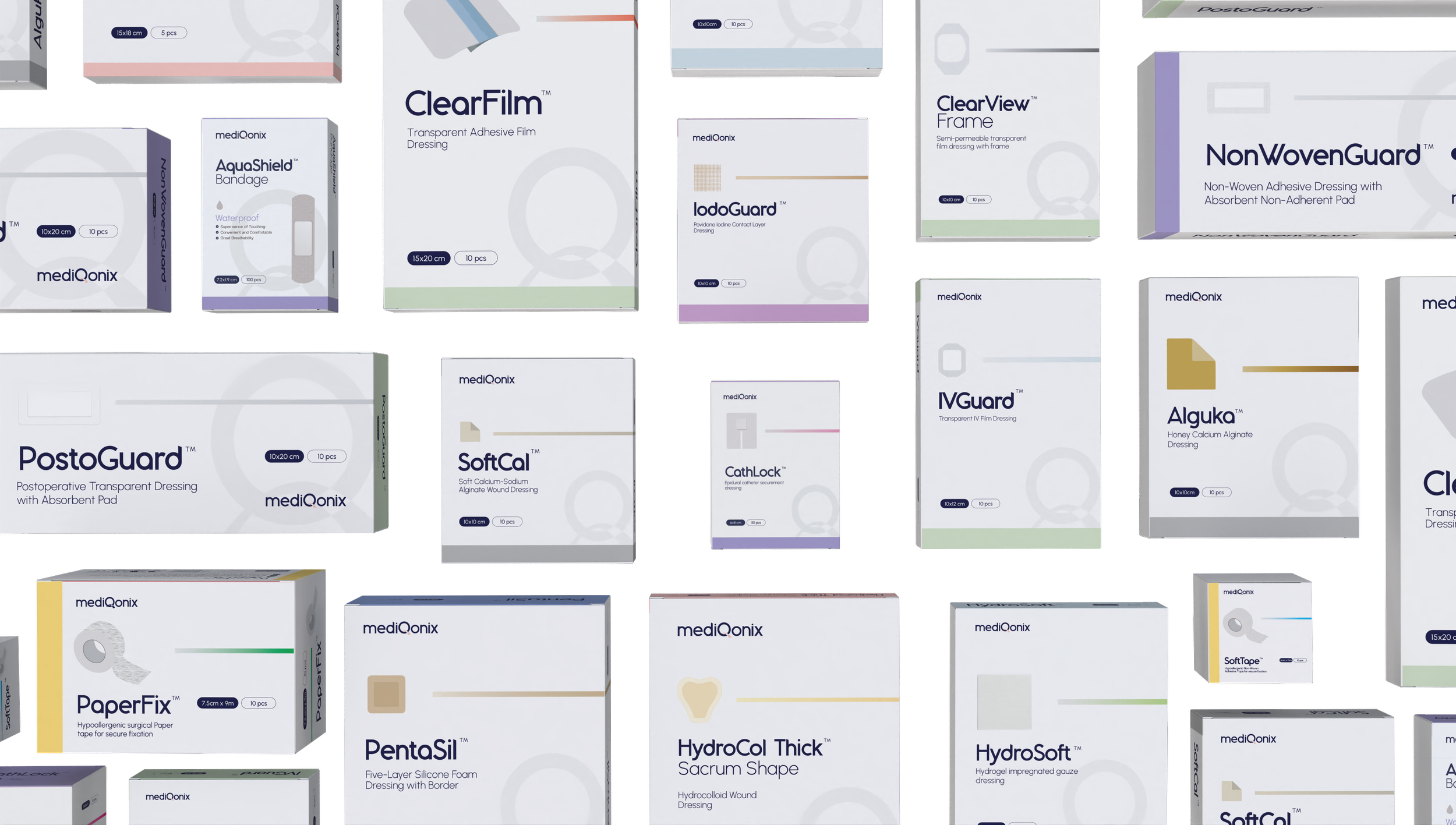 Various medical wound dressings and supplies in boxes, including adhesives, film dressings, and protective coverings.