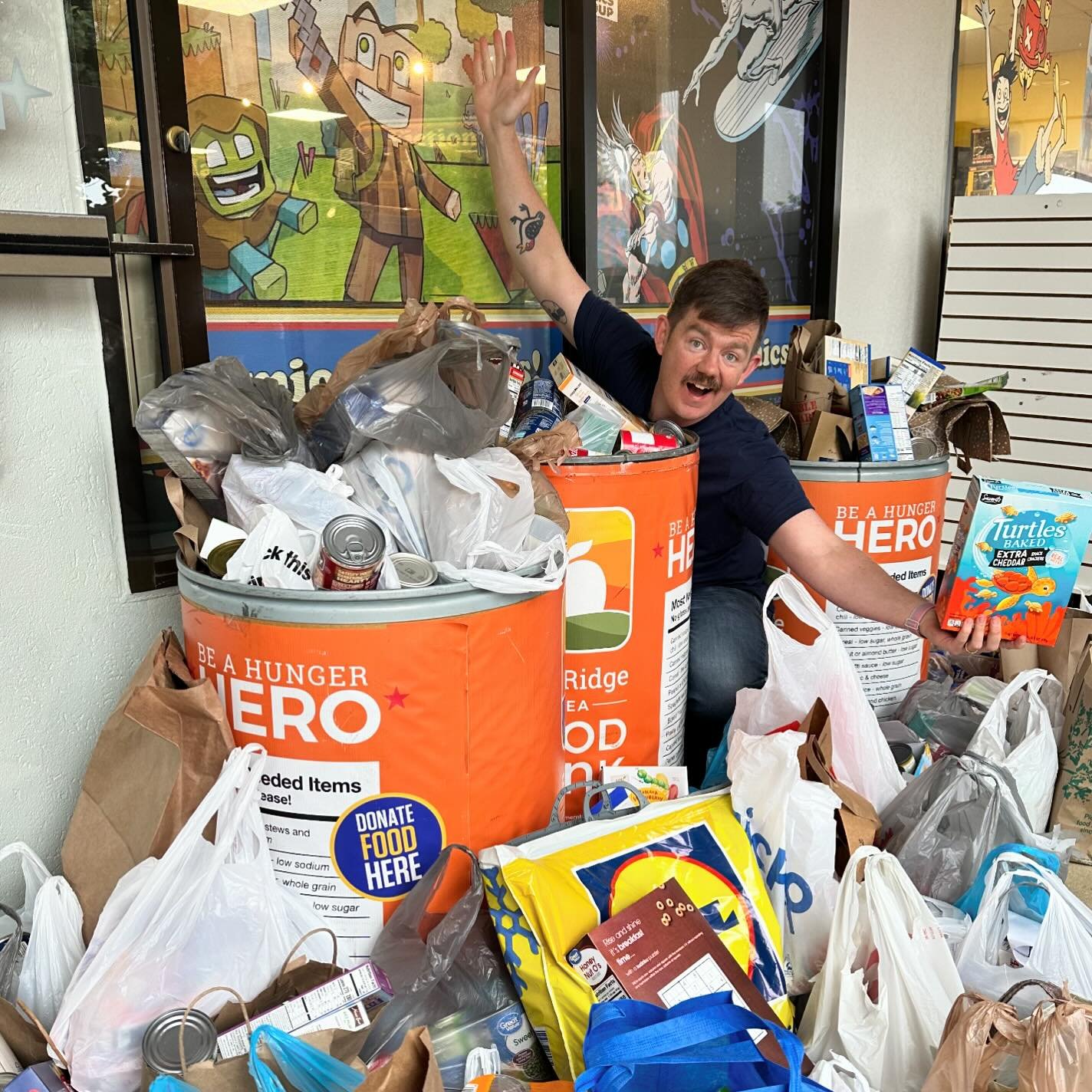 Wowee wow wow wow! What an incredible Free Comic Book Day so far, and what an incredible spread of donations for the Blue Ridge Area Food Bank (Dave is shown for scale and not included). Thank you so much to all the friendly faces we&rsquo;ve seen so