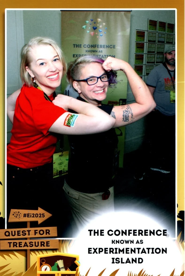 Kelly & Erin posing with Kelly's Make Things Better, Not Just Different tattoo