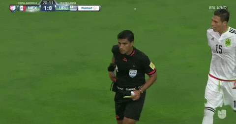 Football ref showing a red card