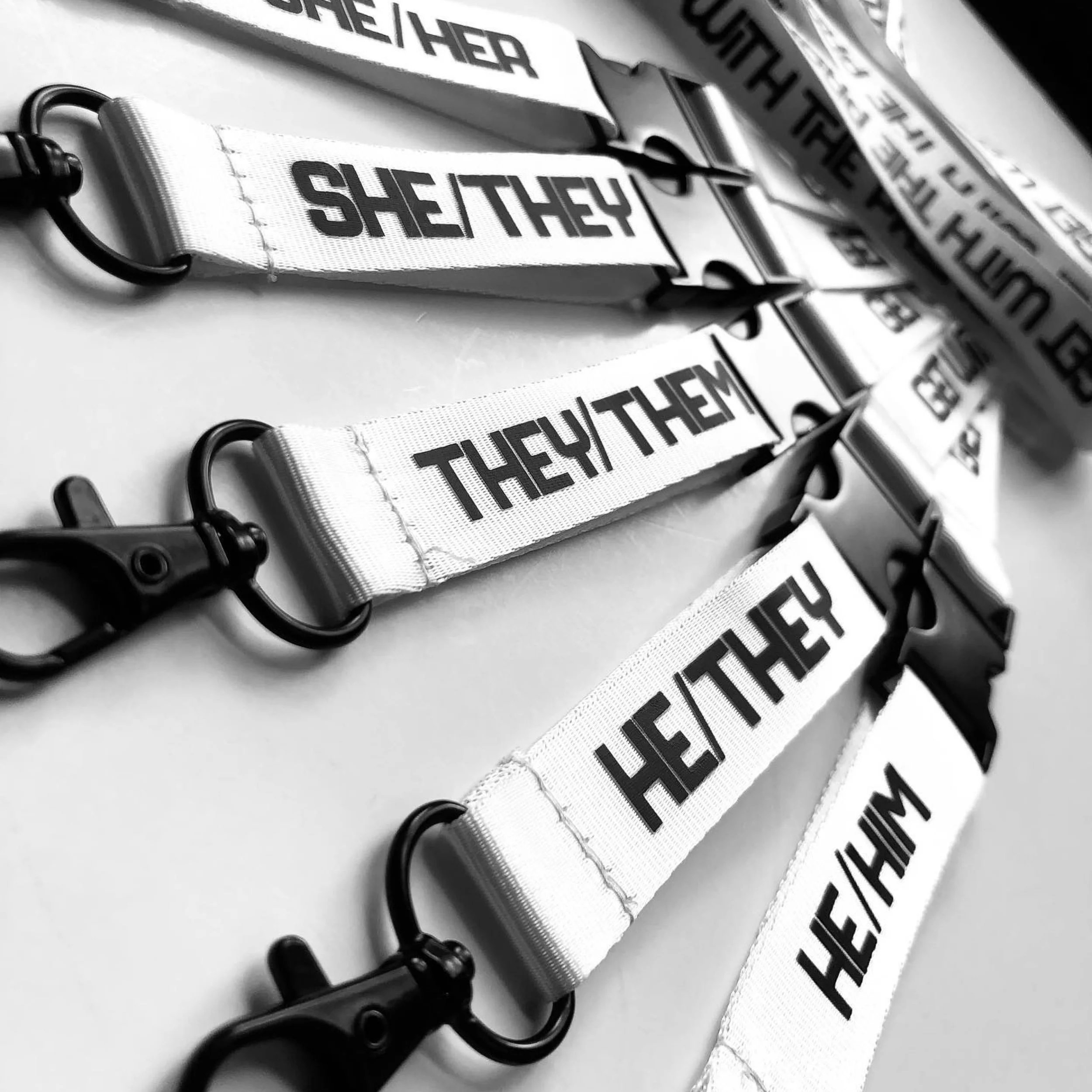 Get With The Pronouns-Lanyards White-Famm.jpg