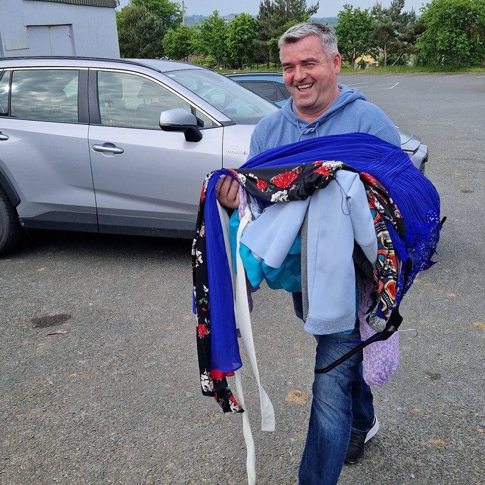 All hands on deck.  Set up for tomorrow's Dress and Bag sale is under way. Rathnew AFC John Snell getting stuck in.