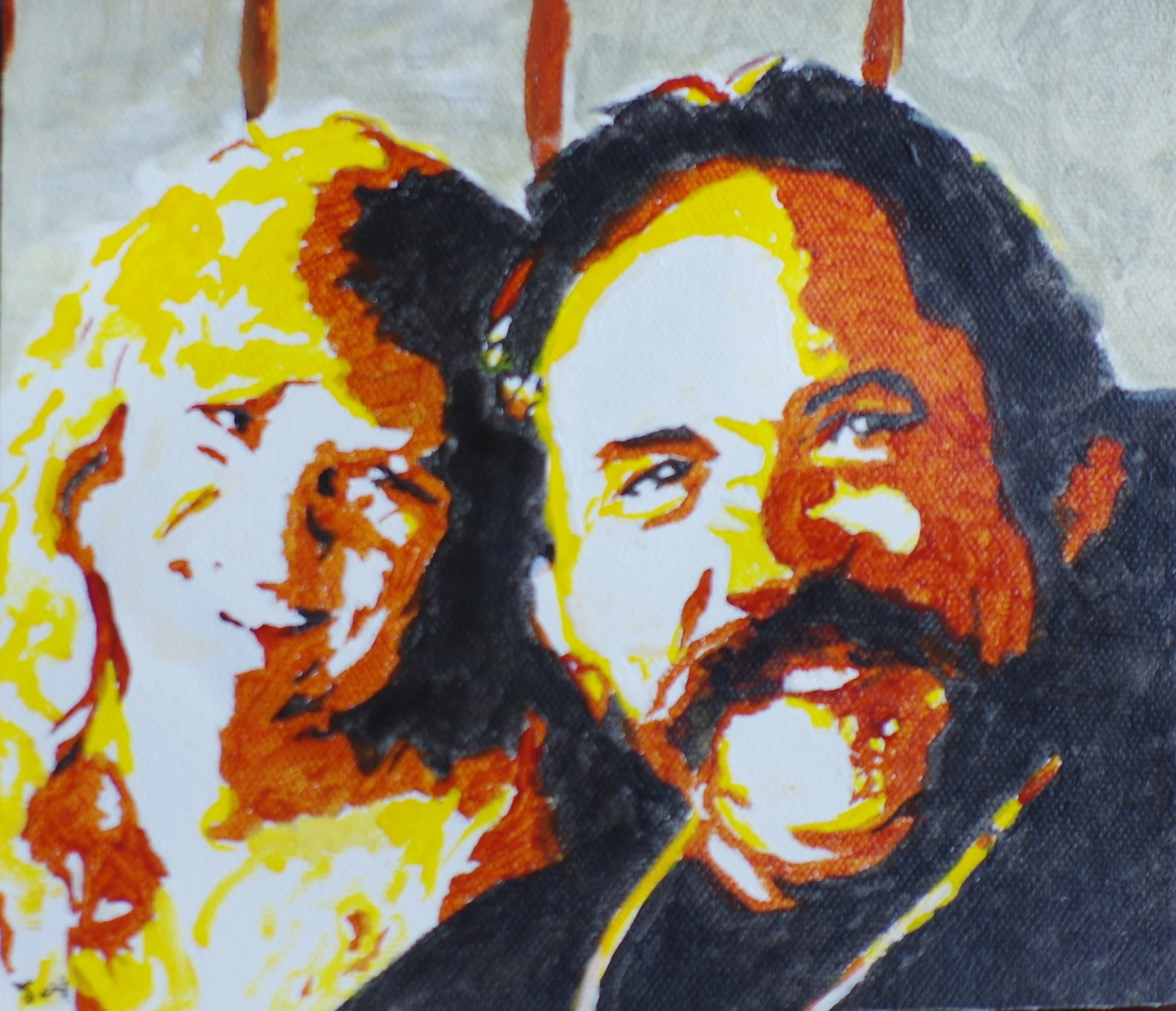 Close-up of a colorful embroidered fabric artwork depicting a couple