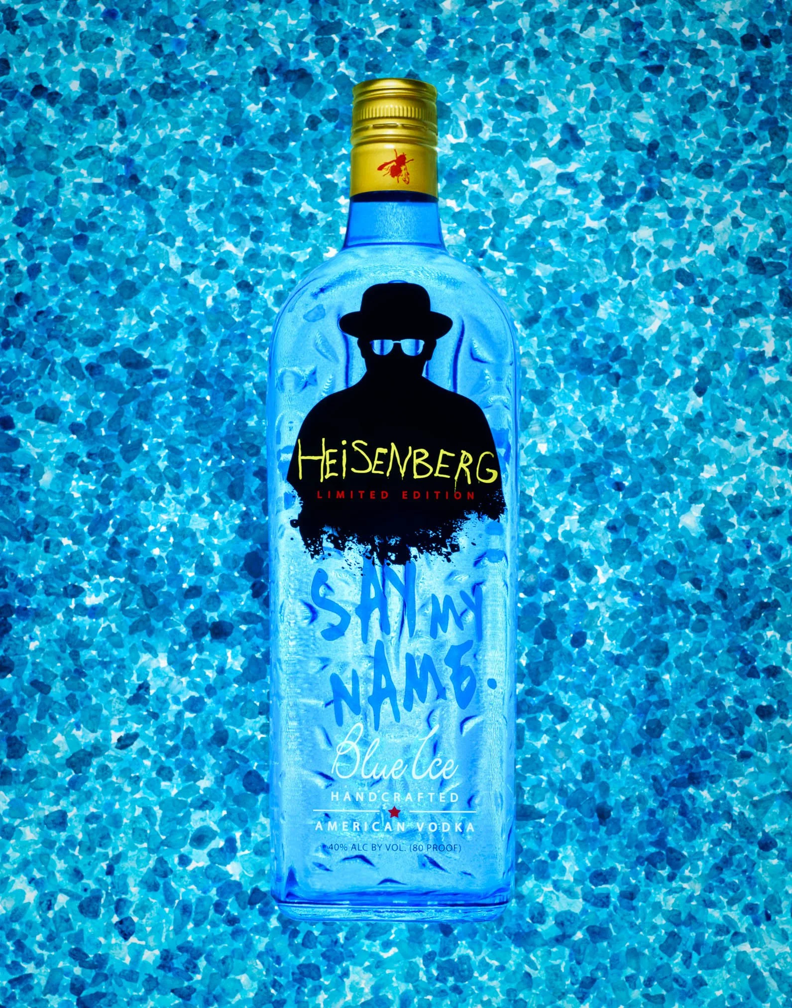 A bottle of Heisenberg Blue Ice vodka with a blue hue textured background. The label includes the words 'Heisenberg,' 'Limited Edition,' 'Blue Ice,' and mentions it is handcrafted American vodka. Breaking bad commercial photography