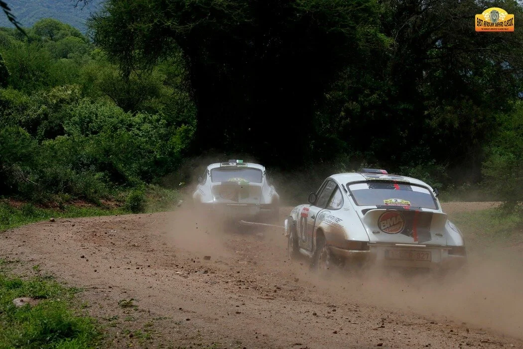 Team spirit shines bright at the East African Safari Classic Rally of 2015 as car number 2, driven by Gregoire de Mevius, is towed by their teammates in car number 9, driven by Bernard Munster, both cars prepared by BMA. De Mevius goes on to finish i