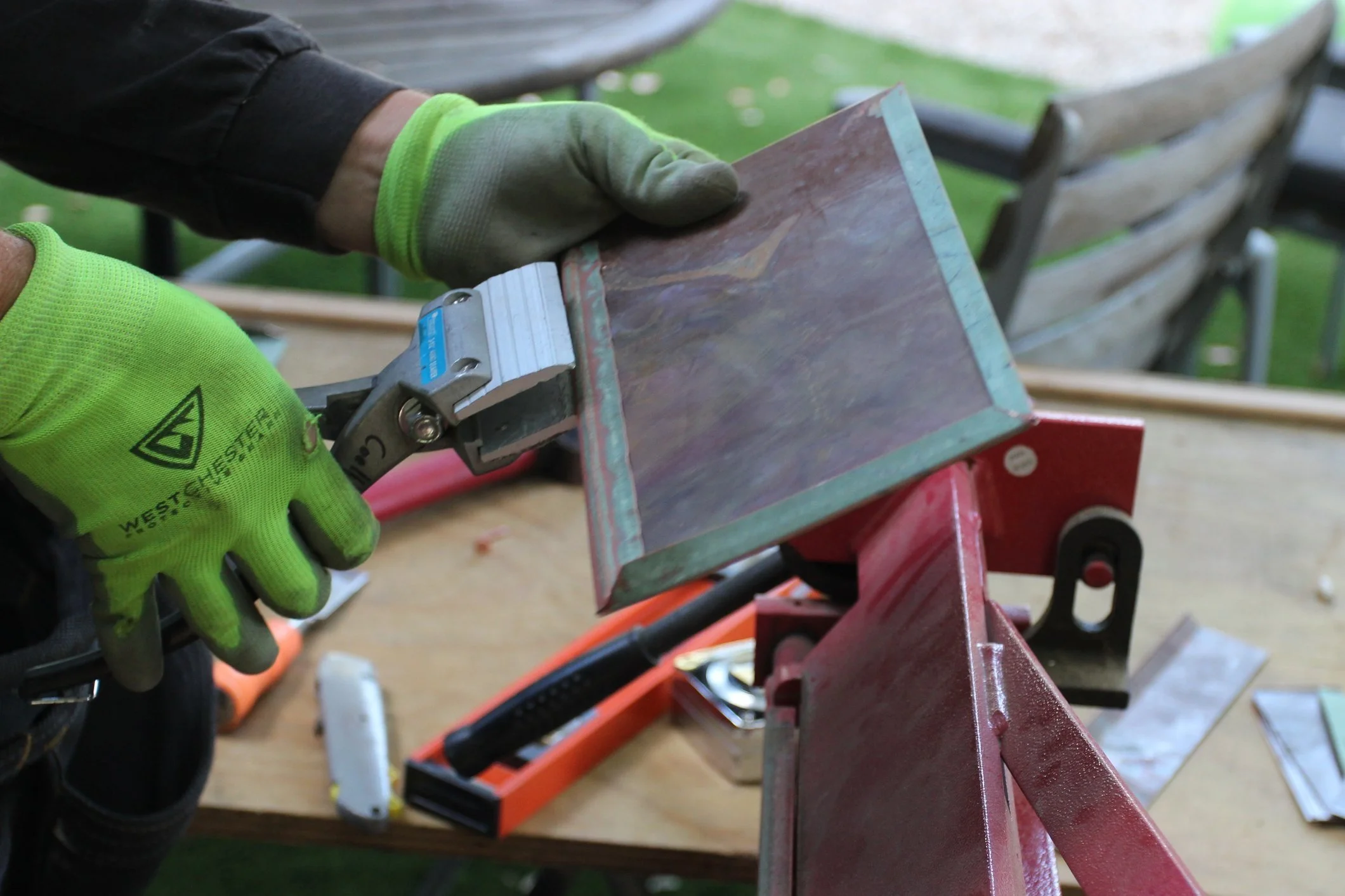Design Draw Build craftsman making tiles from patinated copper.