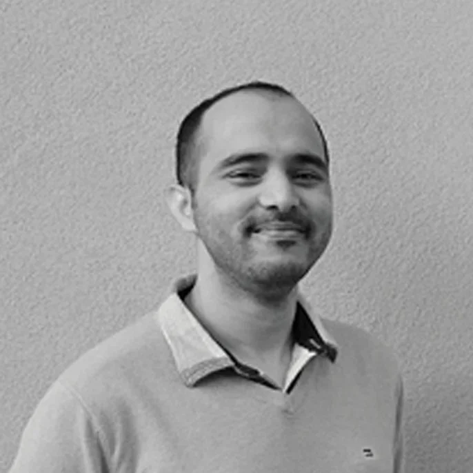 Portrait of a smiling architectural designer at Design Draw Build Architects and Builders in Oakland, California.