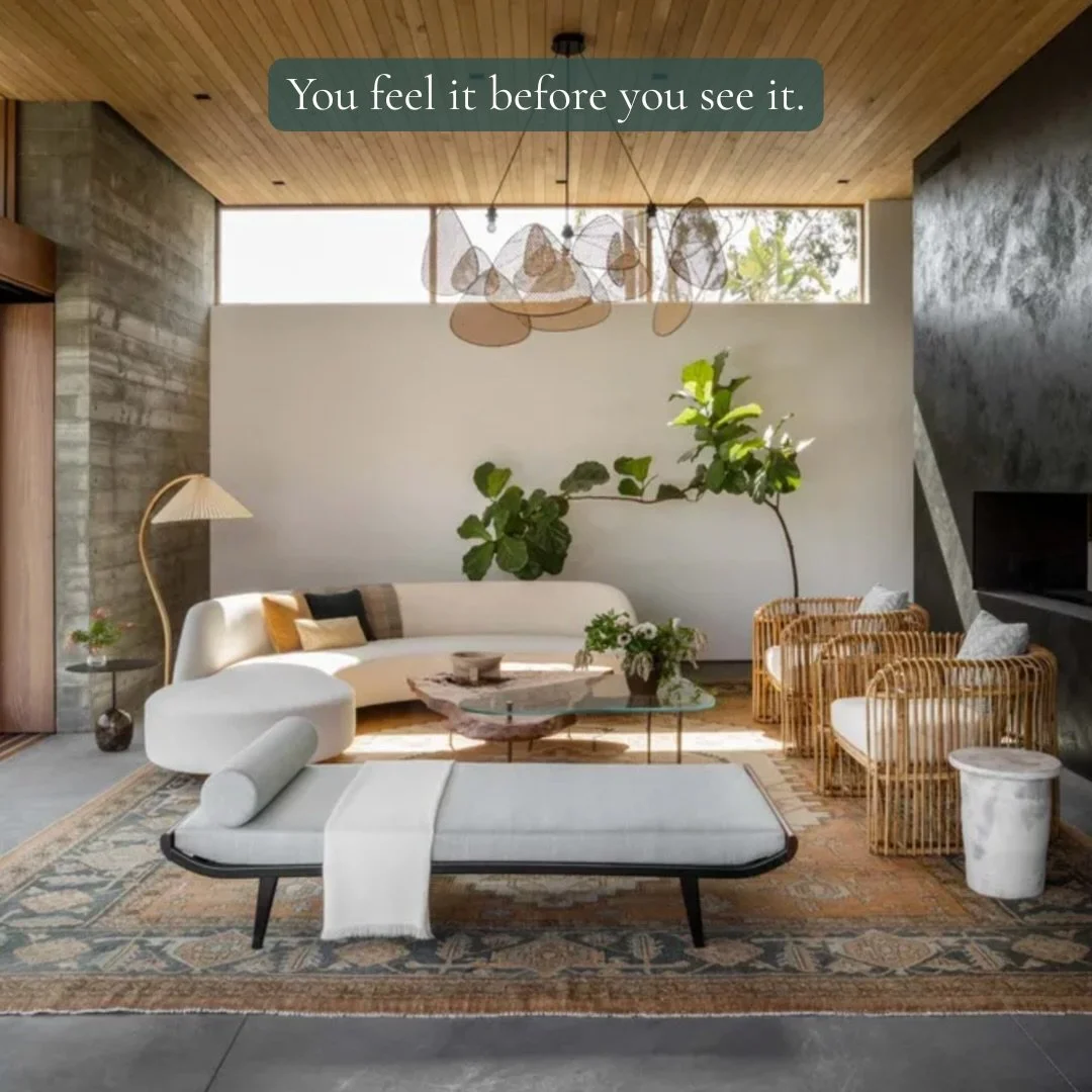 Living room with curved seating, natural textures, and balanced layout supporting comfort and energy flow